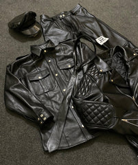 Black leather uniform shirt and trousers with peaked cap and quilted jacket