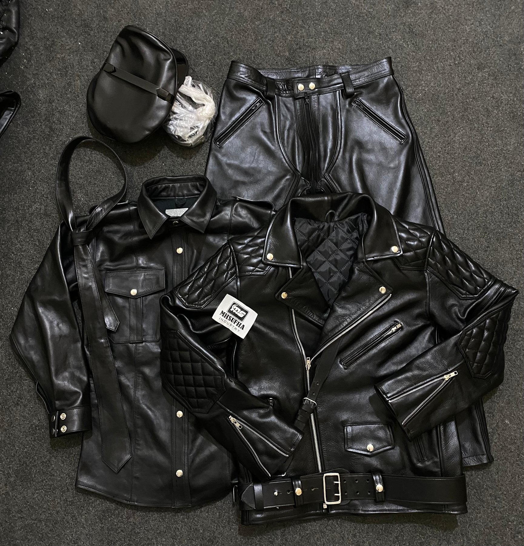 Black leather bundle showing jacket quilting and trouser detail