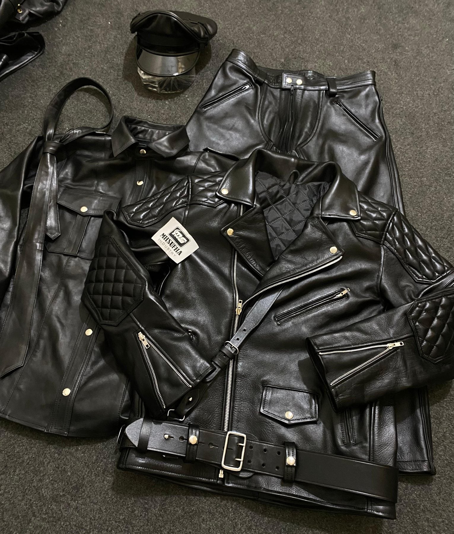 Full black leather bundle with peaked cap, jacket, shirt, trousers and tie