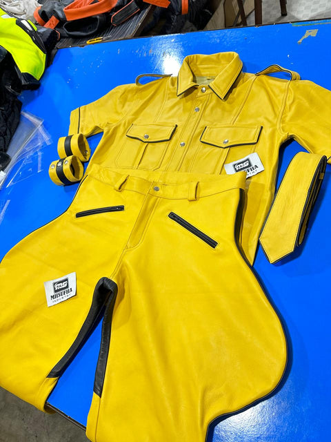 Yellow leather uniform shirt and trousers with black piped seams and zip pockets